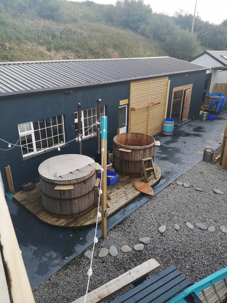 Unique Accommodation In Ireland: Hot tubs in the outdoor area of The Atlantic Lodge